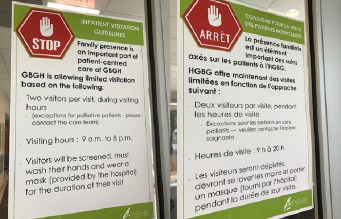 Inpatient visitation guidelines signs at hospital entrance